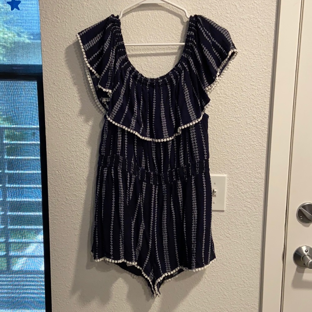 Navy blue romper with white accents